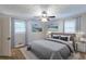 Serene bedroom showcasing a comfortable bed, soft rug, and ample natural light from two windows at 1105 Buckhurst Dr, Atlanta, GA 30349