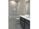 Bathroom featuring a shower, tub, toilet, and modern vanity at 1250 Winterhaven Dr, Cumming, GA 30041