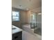 Modern bathroom featuring a separate shower, tub, and double sinks at 1250 Winterhaven Dr, Cumming, GA 30041