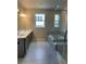 Modern bathroom featuring a separate shower, tub, and double sinks at 1250 Winterhaven Dr, Cumming, GA 30041