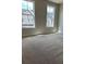 Bedroom with neutral paint and two large windows at 1250 Winterhaven Dr, Cumming, GA 30041