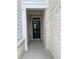 Close up of a front door with white brick and siding at 1250 Winterhaven Dr, Cumming, GA 30041