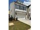 Charming two-story home featuring white siding, black shutters, and a convenient two-car garage at 1250 Winterhaven Dr, Cumming, GA 30041