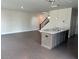 Open-concept living room, kitchen with island, with dark hardwood floors and staircase at 1250 Winterhaven Dr, Cumming, GA 30041