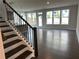 Living room featuring hardwood floors, neutral paint, and large windows at 1250 Winterhaven Dr, Cumming, GA 30041