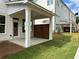 Exterior view of covered patios with privacy screens along the back of the building at 1250 Winterhaven Dr, Cumming, GA 30041