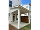 Covered patio features white columns and a wooden privacy screen, perfect for outdoor relaxation at 1250 Winterhaven Dr, Cumming, GA 30041