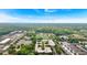 A beautiful aerial view of the property surrounded by lush greenery and buildings under a partly cloudy sky at 195 Arizona Ne Ave # 199, Atlanta, GA 30307