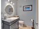 This half bathroom features a round mirror, modern vanity, and sleek fixtures at 195 Arizona Ne Ave # 199, Atlanta, GA 30307