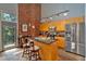 Modern kitchen with granite counters, stainless appliances, and island with barstool seating and a balcony at 195 Arizona Ne Ave # 199, Atlanta, GA 30307