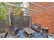 Outdoor patio with pergola, cozy seating, and privacy fencing at 195 Arizona Ne Ave # 199, Atlanta, GA 30307