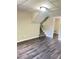 Finished basement area featuring durable flooring, stairs to the main level, and fresh paint at 3800 Leisure Ln, Atlanta, GA 30349