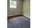Bedroom with a carpeted floor and neutral paint at 3800 Leisure Ln, Atlanta, GA 30349