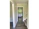 Inviting entryway featuring updated flooring, fresh paint, and a view into the modern kitchen at 3800 Leisure Ln, Atlanta, GA 30349