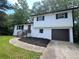 Inviting home featuring painted brick, updated landscaping, and a convenient attached garage at 3800 Leisure Ln, Atlanta, GA 30349