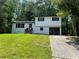 Charming two-story home featuring painted brick, a well-maintained yard, and an attached garage at 3800 Leisure Ln, Atlanta, GA 30349