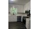 Modern kitchen featuring white cabinets, stainless steel appliances, and ample natural light at 3800 Leisure Ln, Atlanta, GA 30349