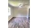 Spacious living room showcasing modern flooring, fresh paint, and abundant natural light at 3800 Leisure Ln, Atlanta, GA 30349