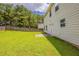 A spacious backyard with a well-maintained lawn and a wooden fence at 440 Pinevale Ct, Atlanta, GA 30349