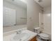 Standard full bathroom with a white sink, toilet, mirror, and tub/shower combo at 440 Pinevale Ct, Atlanta, GA 30349