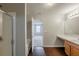 Bathroom featuring a vanity, a shower and a door opening to another room at 440 Pinevale Ct, Atlanta, GA 30349