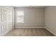 Cozy bedroom with carpeted floors, a window, and a closet at 440 Pinevale Ct, Atlanta, GA 30349