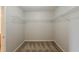 Walk-in closet featuring carpeted floors and wire shelving and an open door on the side at 440 Pinevale Ct, Atlanta, GA 30349