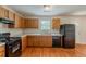 Classic kitchen with wood cabinets, modern appliances, and practical flooring, offering a functional culinary space at 440 Pinevale Ct, Atlanta, GA 30349
