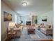 Comfortable living room with neutral tones, fireplace, hardwood floors and plenty of natural light for relaxation at 440 Pinevale Ct, Atlanta, GA 30349