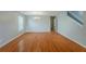 An open living area featuring hardwood floors, a chandelier, and a staircase at 440 Pinevale Ct, Atlanta, GA 30349