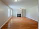 Bright living room with hardwood floors and a fireplace with white molding at 440 Pinevale Ct, Atlanta, GA 30349