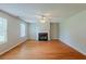 Bright living room with hardwood floors, a fireplace, and neutral-toned walls at 440 Pinevale Ct, Atlanta, GA 30349