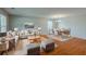 Open concept living room and dining area with stylish furniture, hardwood floors, and plenty of space for entertaining at 440 Pinevale Ct, Atlanta, GA 30349