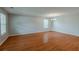 Bright living room with hardwood floors, a chandelier, and neutral-toned walls at 440 Pinevale Ct, Atlanta, GA 30349