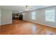 Open living area with hardwood floors, a view of the kitchen, and natural light at 440 Pinevale Ct, Atlanta, GA 30349