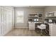 Bright home office with a modern desk, built-in shelves, and a large window for natural light at 440 Pinevale Ct, Atlanta, GA 30349