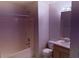 Bathroom with a combination tub and shower, vanity, and a toilet at 133 Magazine St, Dallas, GA 30157