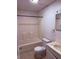Standard bathroom featuring a tub-shower combination, tile flooring, toilet, and vanity with sink at 133 Magazine St, Dallas, GA 30157