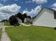 Residential street view showcasing a well-maintained lawn, surrounding houses, and parked cars at 133 Magazine St, Dallas, GA 30157