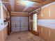 Spacious garage awaiting finishing touches, featuring an open ceiling and a gray garage door at 133 Magazine St, Dallas, GA 30157