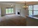 Bright living room with a marble fireplace and large windows for natural light at 133 Magazine St, Dallas, GA 30157
