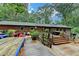 View of a multi-tiered back deck that has a seating area, an outdoor grill, and steps up to the house at 3229 Richwood Dr, Duluth, GA 30096