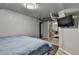 Basement bedroom with blue comforter, TV, and doorway to adjoining living space at 3229 Richwood Dr, Duluth, GA 30096