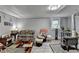 Cozy basement living area with diverse seating arrangements and wood-burning stove at 3229 Richwood Dr, Duluth, GA 30096