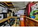 Unfinished basement storage space with wooden shelves, boxes, and stacked supplies at 3229 Richwood Dr, Duluth, GA 30096