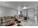 Basement living area featuring diverse seating arrangements and wood-burning stove at 3229 Richwood Dr, Duluth, GA 30096