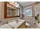 Bathroom featuring a vanity with a sink, toilet, and bath tub with tiled wall and shower at 3229 Richwood Dr, Duluth, GA 30096