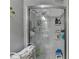Bathroom shower with shower head and built in shelves for storage at 3229 Richwood Dr, Duluth, GA 30096