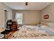 Bedroom with hardwood floors, natural light from a window, and a comfortable work space at 3229 Richwood Dr, Duluth, GA 30096