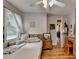 Comfortable bedroom with wood flooring, a ceiling fan, and ample natural light at 3229 Richwood Dr, Duluth, GA 30096